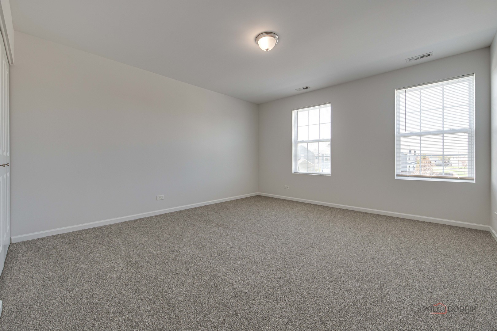 1385 Broadland Drive Pingree Grove, IL 60140 - Photo 23 of 40 an empty room with windows