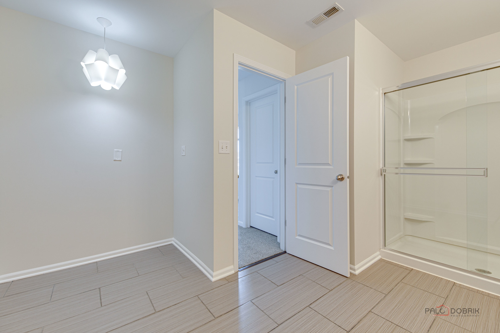 1385 Broadland Drive Pingree Grove, IL 60140 - Photo 35 of 40 a view of an empty room with window and wooden floor