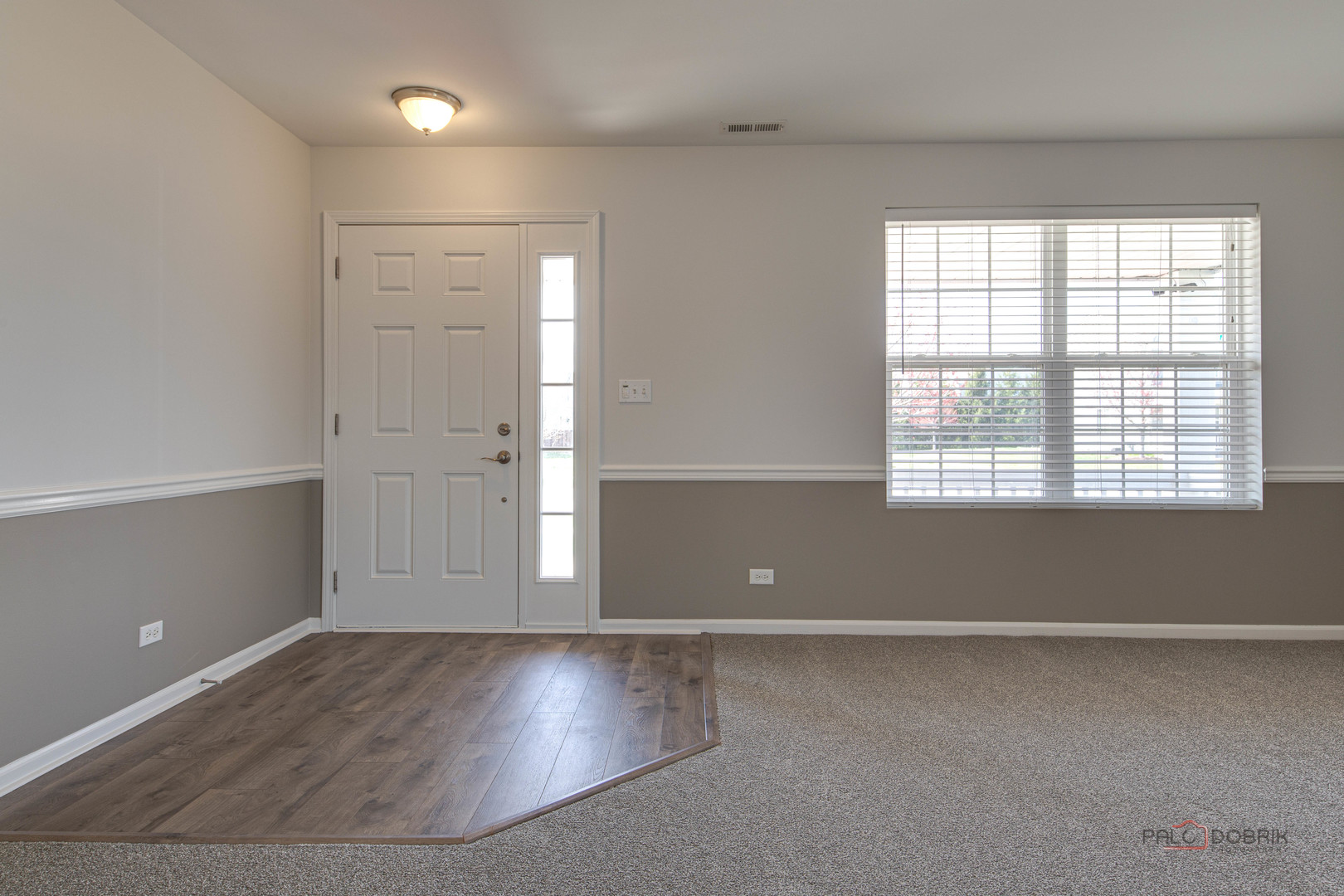 1385 Broadland Drive Pingree Grove, IL 60140 - Photo 4 of 40 an empty room with wooden floor and windows