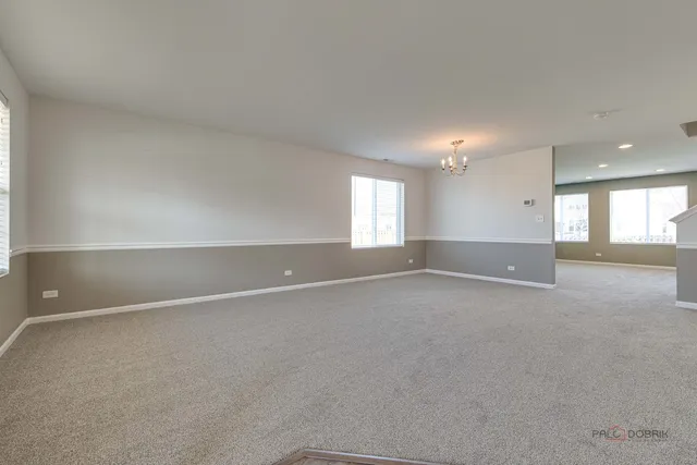 an empty room with a empty space and window