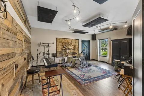 a living room with fireplace furniture and a flat screen tv