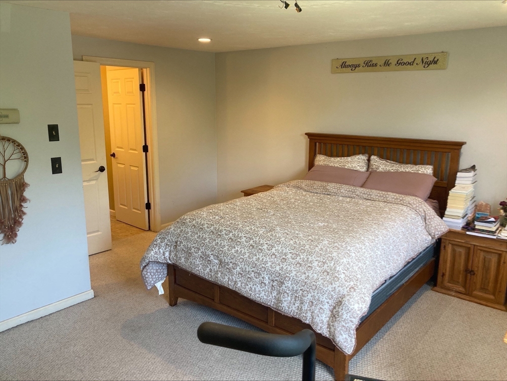 337 Mason Rd Extension Dudley, MA 01571 - Photo 21 of 31 a bedroom with a bed and a dresser