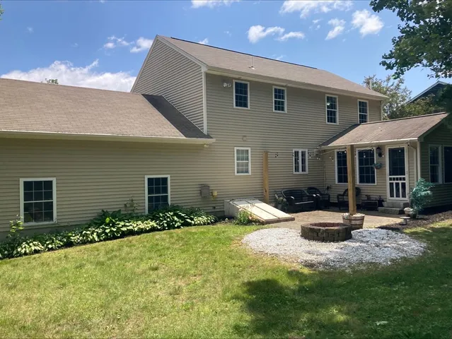 a front view of a house with yard and porch
