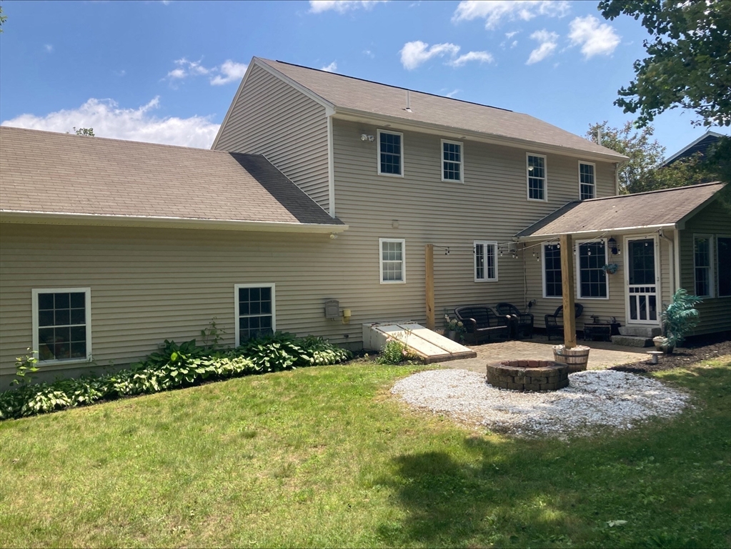 337 Mason Rd Extension Dudley, MA 01571 - Photo 3 of 31 a front view of a house with yard and porch