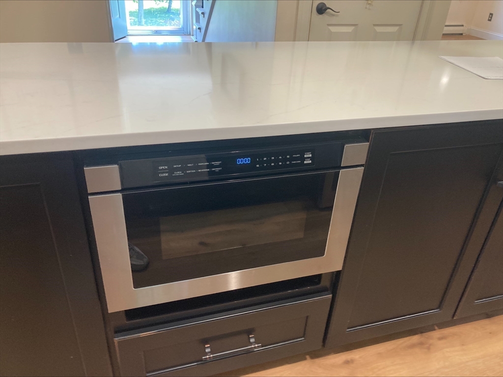 337 Mason Rd Extension Dudley, MA 01571 - Photo 8 of 31 a stove top oven sitting inside of a kitchen