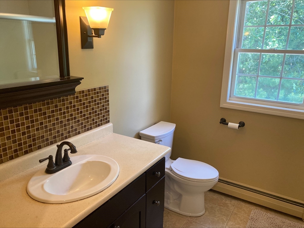 337 Mason Rd Extension Dudley, MA 01571 - Photo 10 of 31 a bathroom with a sink and a toilet