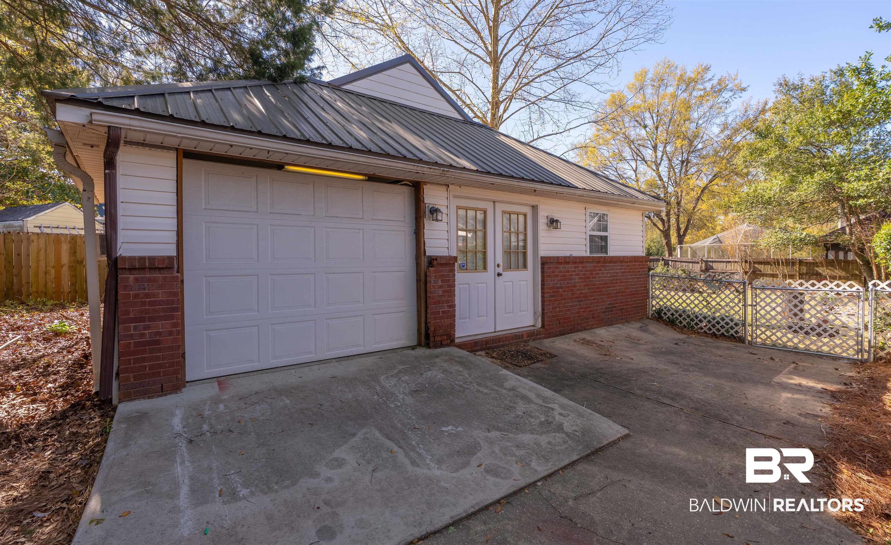 4 Judd Trail Daphne, AL 36527 - Photo 41 of 45 Garage with concrete driveway and fence