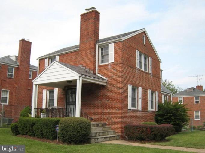 3601 28th Street Northeast Washington, DC 20018 - Photo 1 of 24 a front view of a house with garden