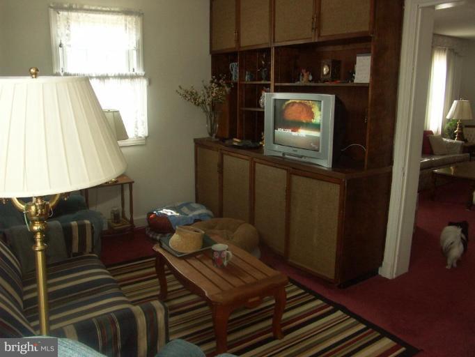 3601 28th Street Northeast Washington, DC 20018 - Photo 6 of 24 a living room with furniture and a flat screen tv