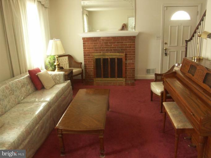 3601 28th Street Northeast Washington, DC 20018 - Photo 7 of 24 a living room with furniture and a fireplace
