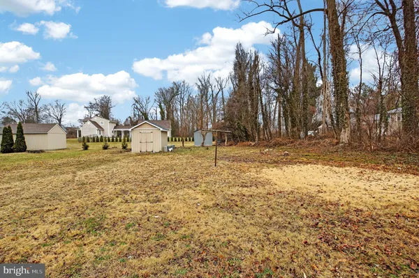a picture of a bench in front of a wall