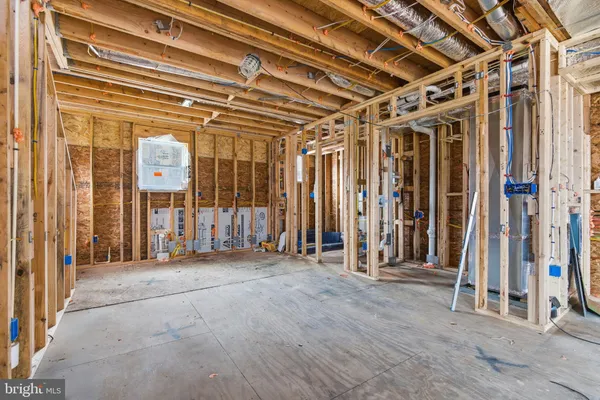 a view of front door of house and living room