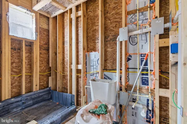 a view of an empty room with wooden walls