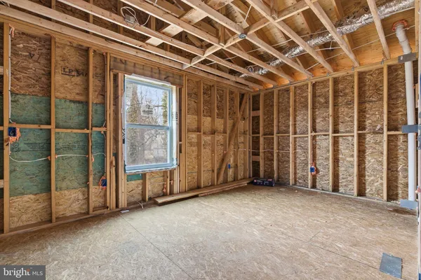 a view of an empty room with windows