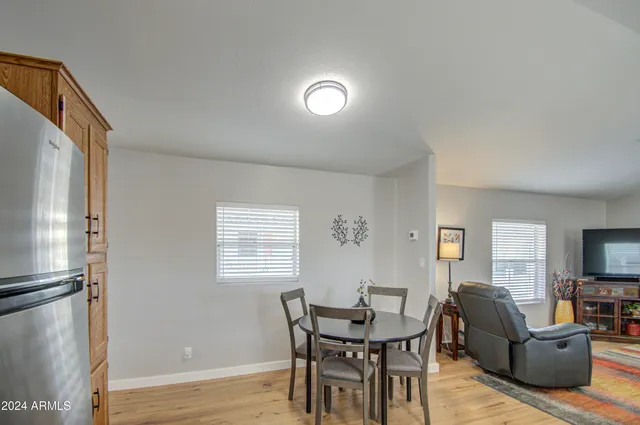 a view of a livingroom with furniture and window
