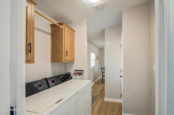 a room that has a sink and a bed in it