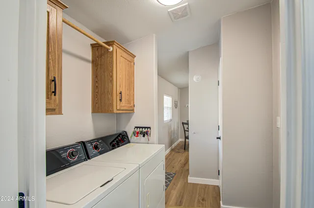 a room that has a sink and a bed in it