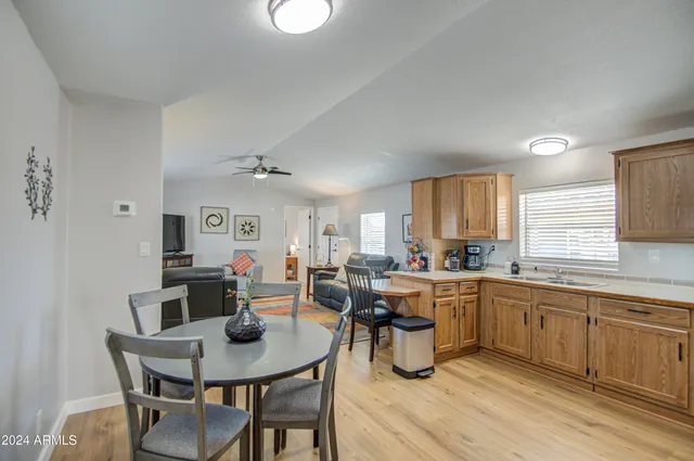 a kitchen with lots of counter top space and dining table
