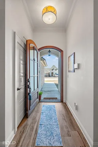 a view of an entryway door and hallway