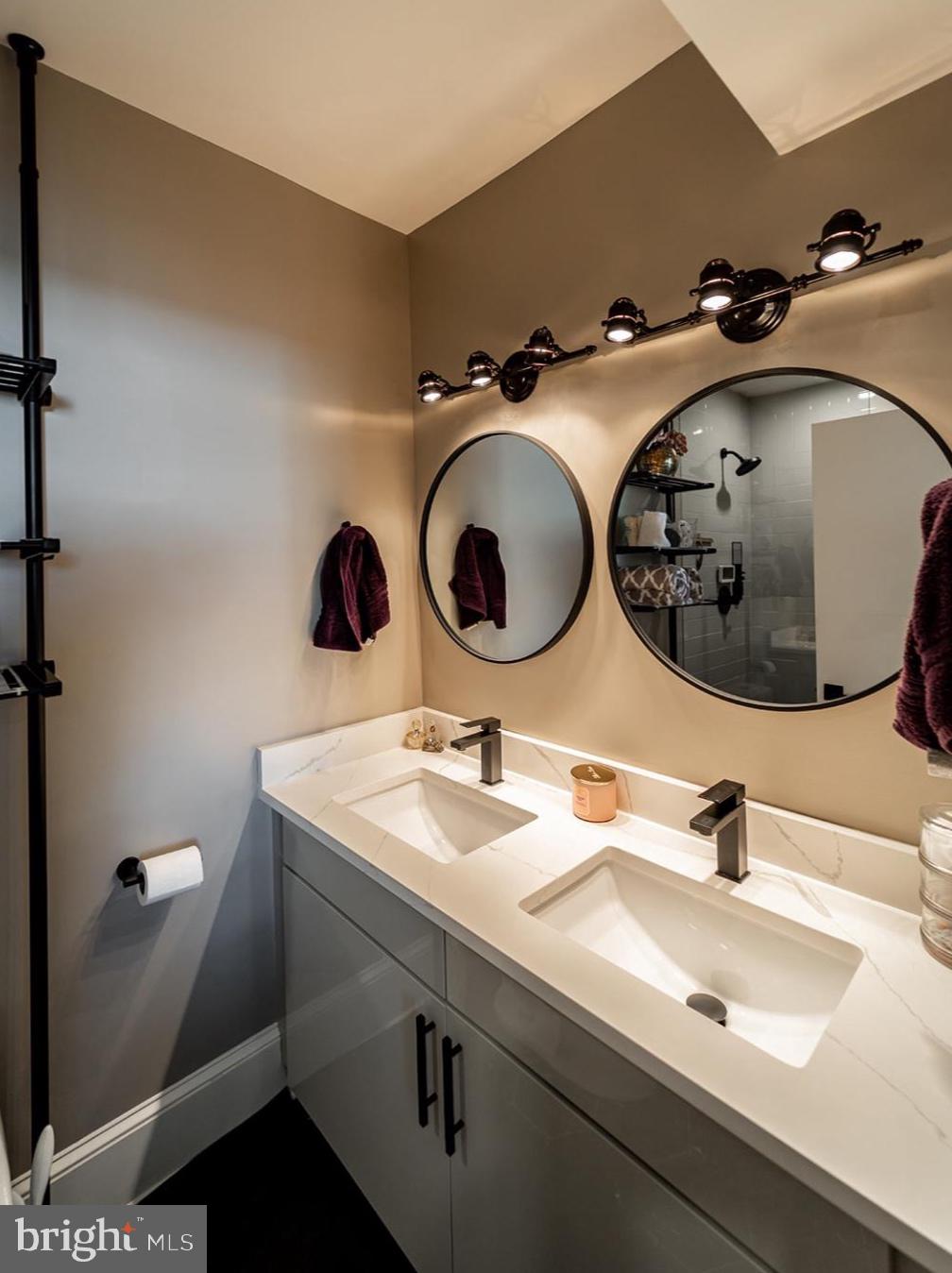 1919 Bennett Place Northeast Washington, DC 20002 - Photo 9 of 18 Sleek dual-sink modern bathroom design.