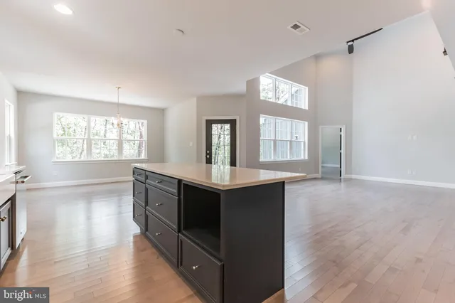 a kitchen with stainless steel appliances granite countertop a stove and a sink
