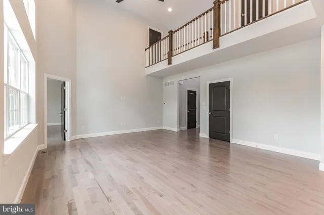 a view of an entryway with wooden floor