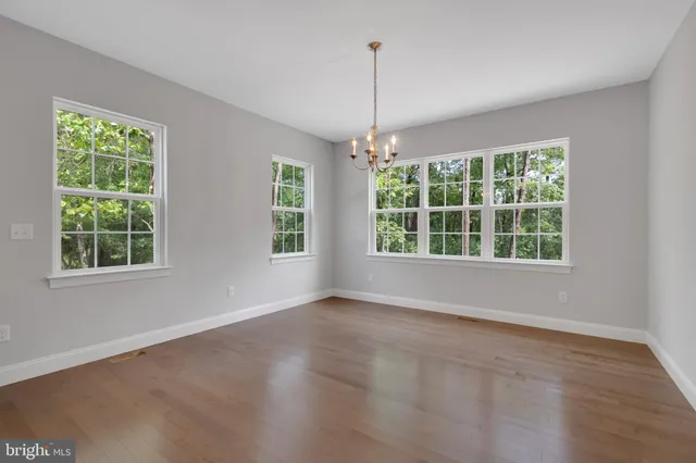 a view of an empty room with windows