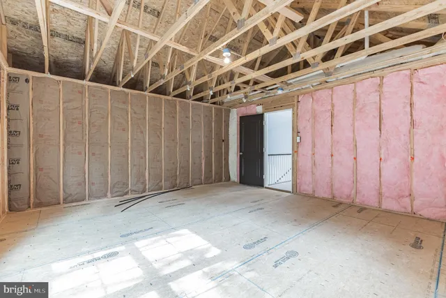 a view of a room with wooden walls
