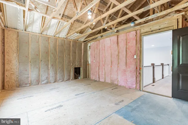 a view of a room with wooden walls