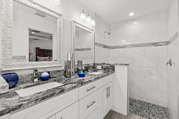 a bathroom with a bathtub and a shower