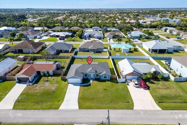an aerial view of residential houses with outdoor space