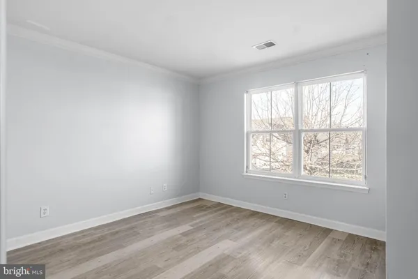 a view of room with wooden floor