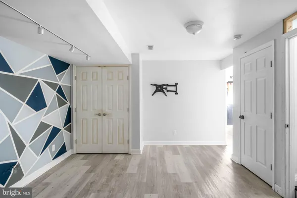 an empty room with wooden floor