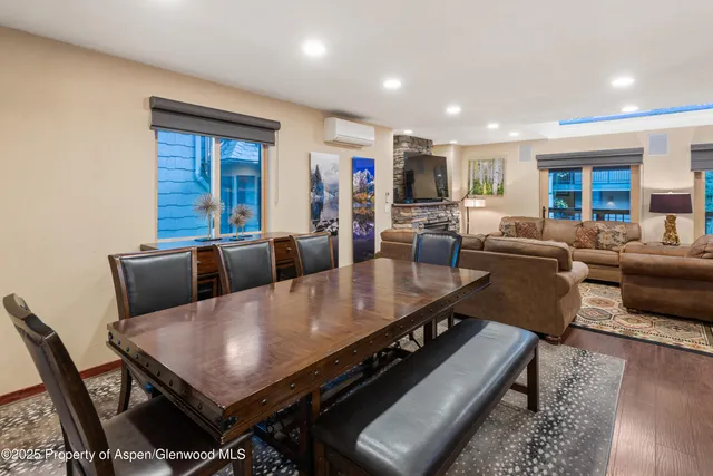 a living room with furniture a rug and a window
