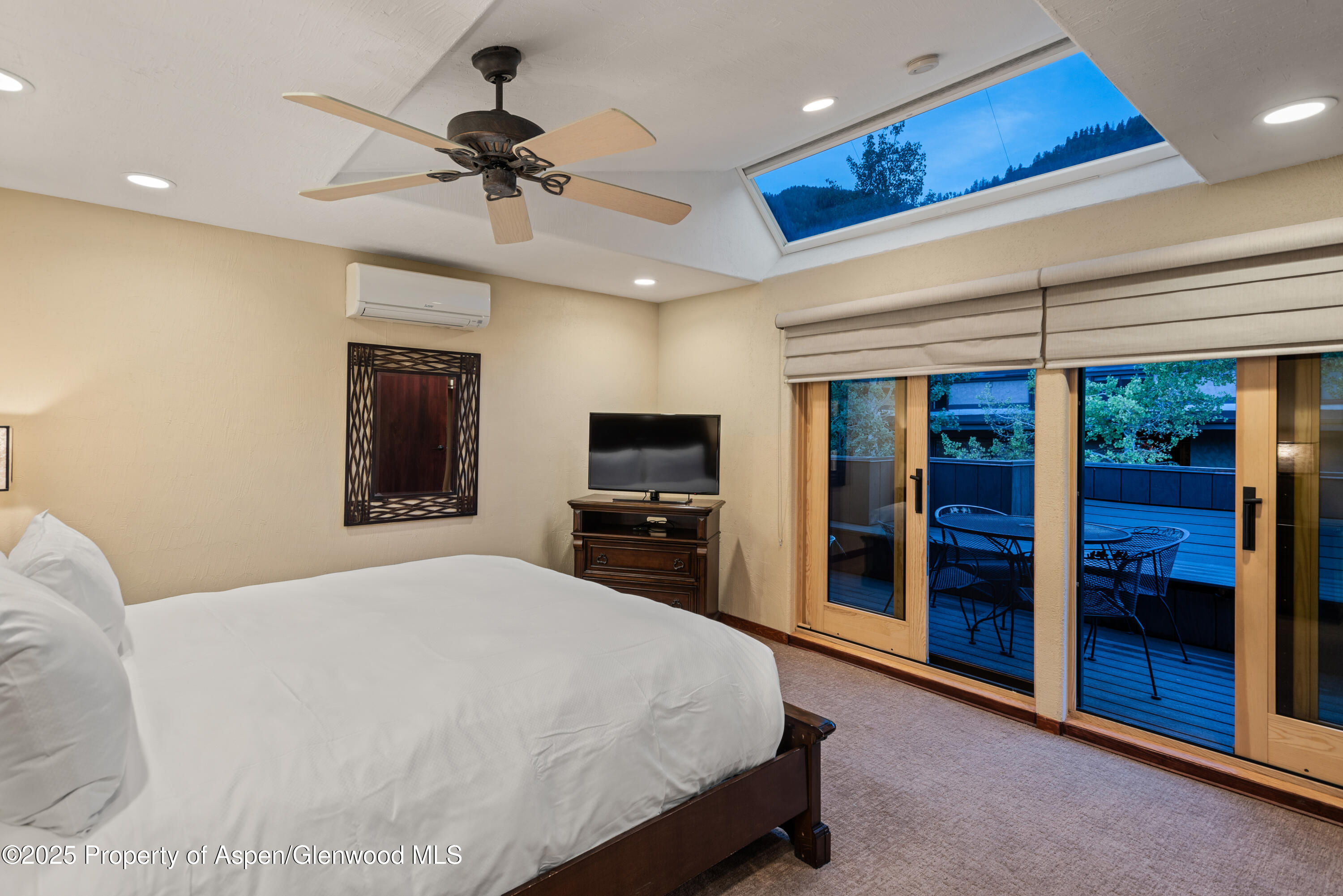 650 South Monarch Street, Unit 4 Aspen, CO 81611 - Photo 16 of 37 a bedroom with a bed and a walk in closet