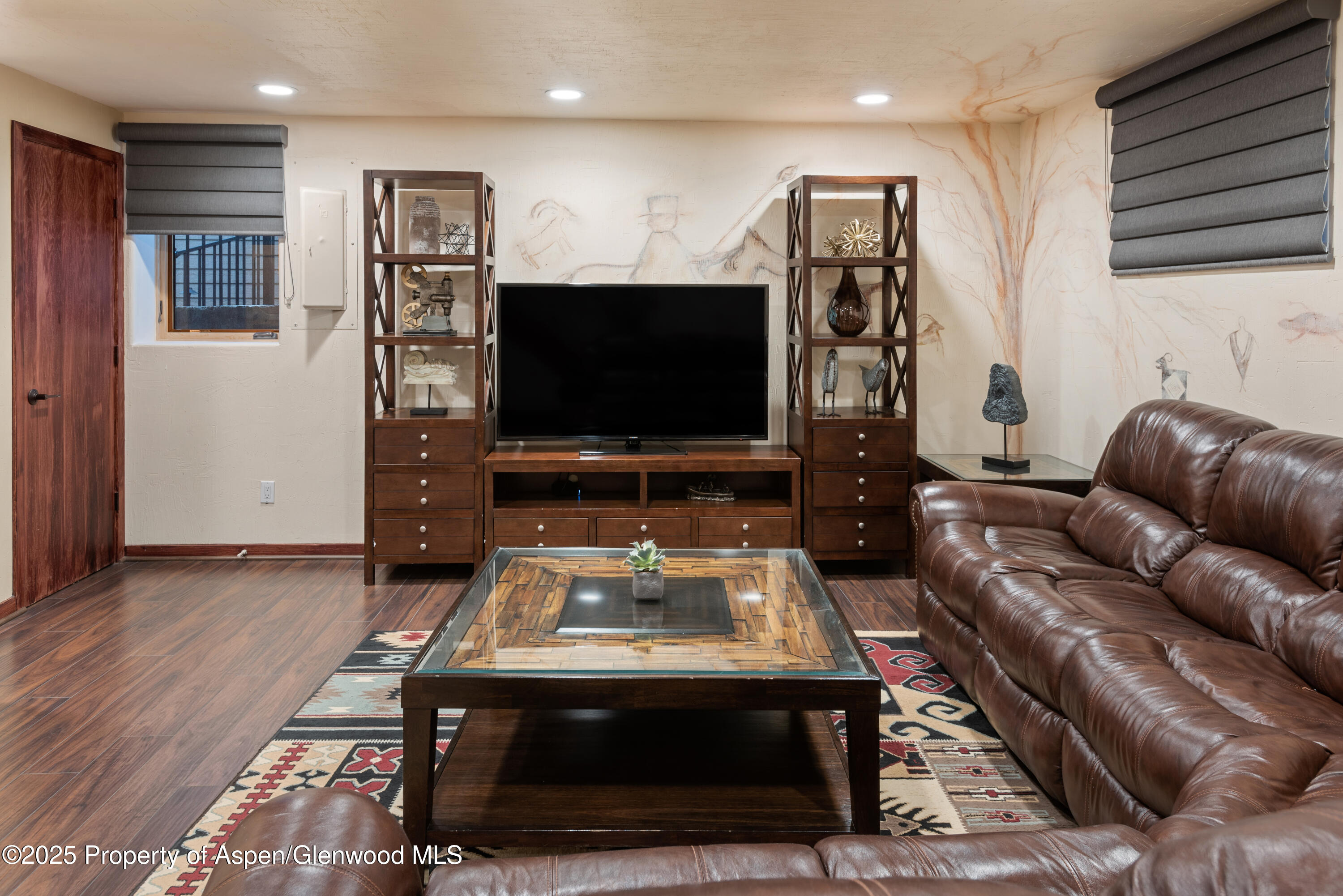 650 South Monarch Street, Unit 4 Aspen, CO 81611 - Photo 33 of 37 a living room with furniture and a flat screen tv