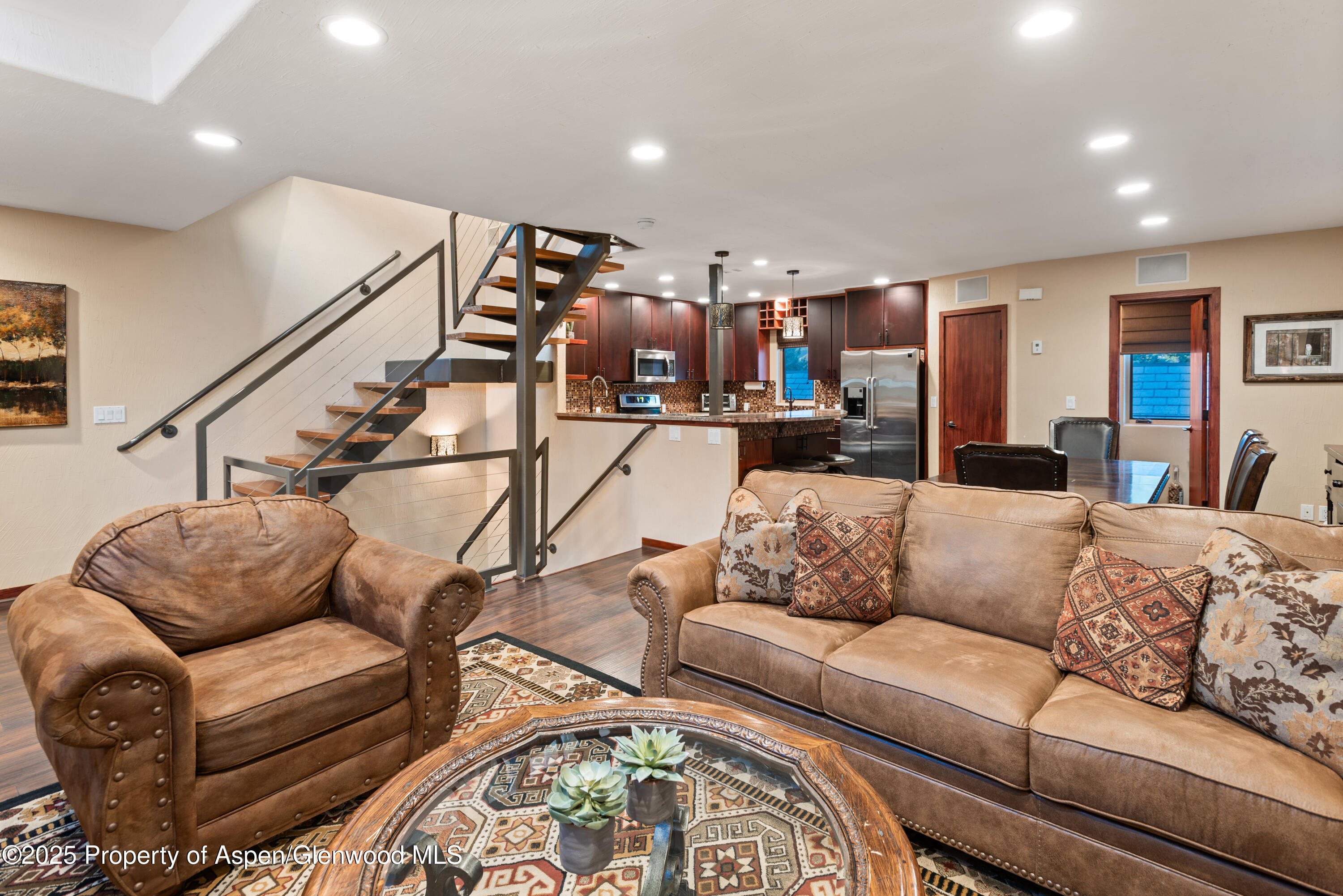 650 South Monarch Street, Unit 4 Aspen, CO 81611 - Photo 6 of 37 a living room with furniture and stairs