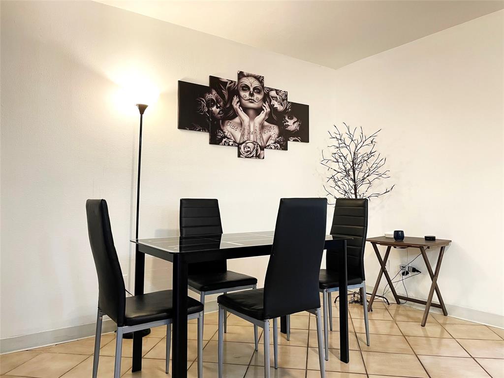 42 Matador Lane, Unit 524 Fort Lauderdale, FL 33324 - Photo 5 of 10 a view of a dining room with furniture and wooden floor