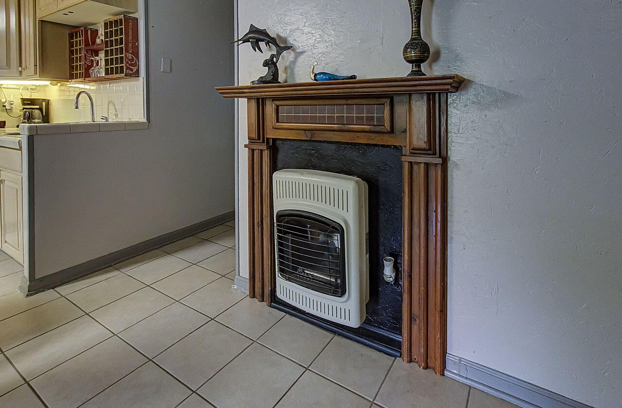 184 Davidson Hollow Road Heiskell, TN 37754 - Photo 18 of 40 a view of an empty room with a fireplace and a window