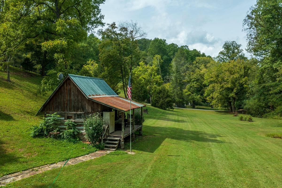 184 Davidson Hollow Road Heiskell, TN 37754 - Photo 5 of 40 a view of a wooden deck and garden