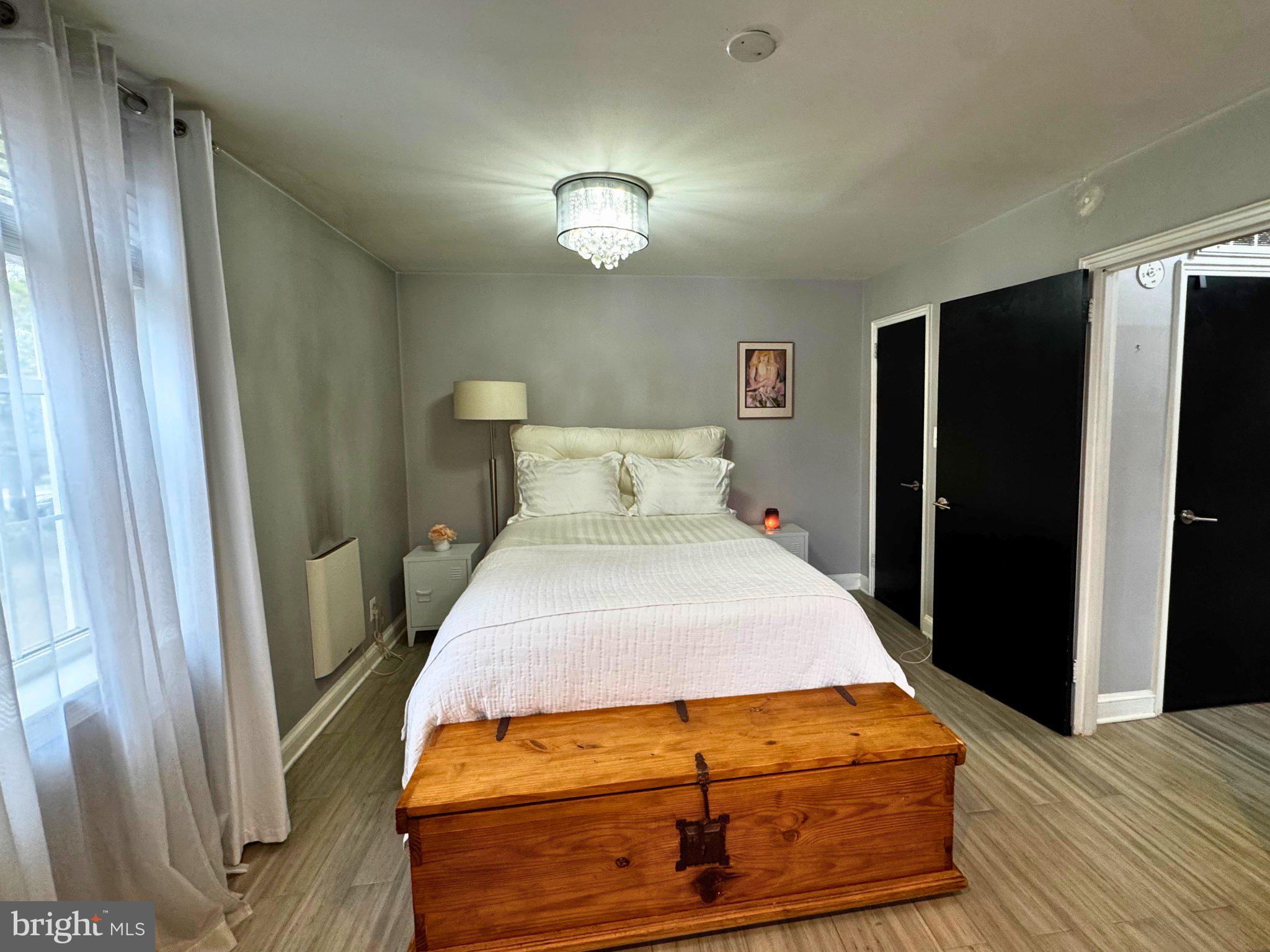 24 South Old Glebe Road, Unit 101 Arlington, VA 22204 - Photo 13 of 19 Serene bedroom with rustic charm.