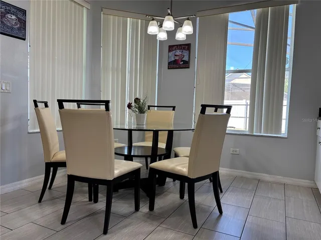 a view of a chairs and table in the room