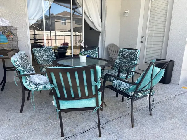 a bed sitting in a bedroom next to a window with storage