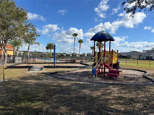 a view of swimming pool with outdoor seating