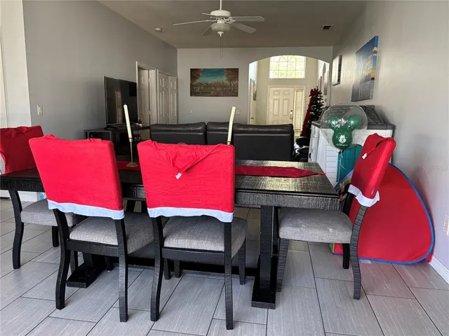 a view of a dining room with furniture and a window
