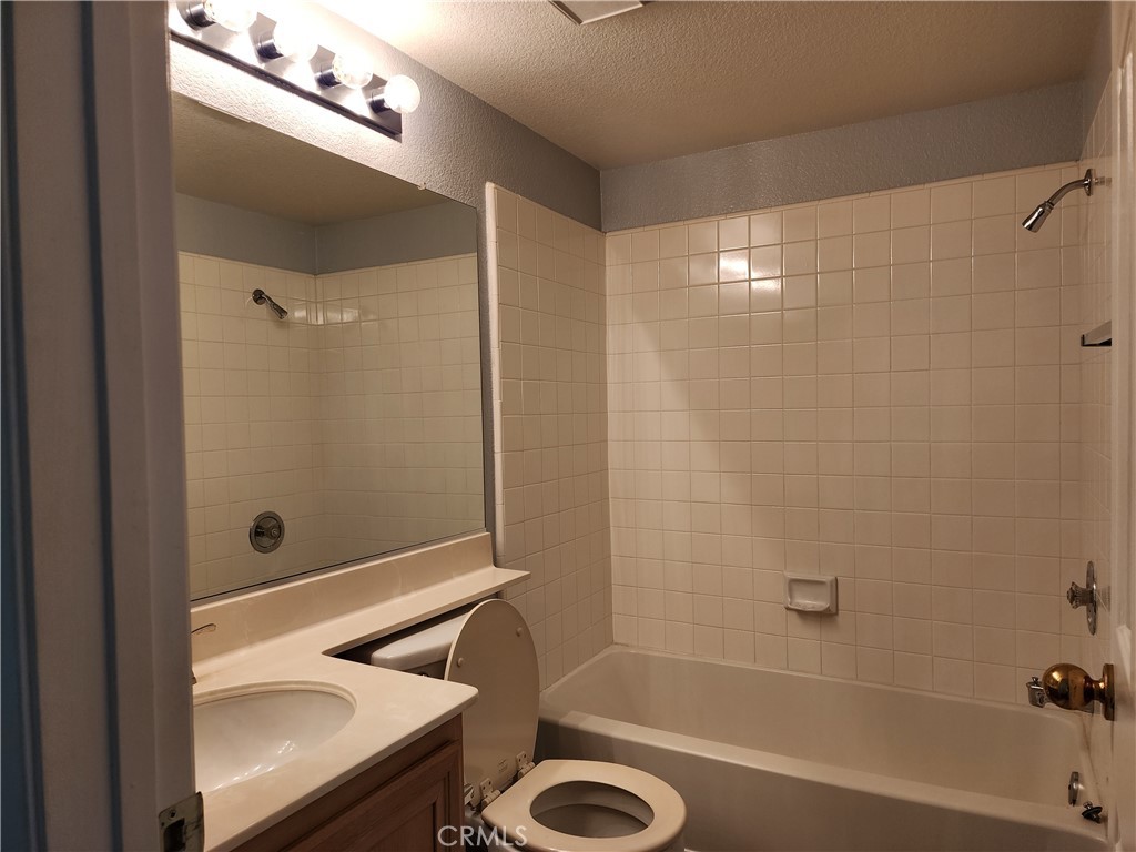 7350 Greenhaven Avenue, Unit 59 Rancho Cucamonga, CA 91730 - Photo 16 of 20 a bathroom with a tub a sink and a shower