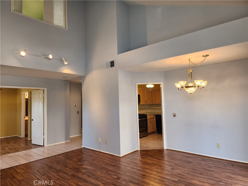 7350 Greenhaven Avenue, Unit 59 Rancho Cucamonga, CA 91730 - Photo 3 of 20 a view of a livingroom with wooden floor