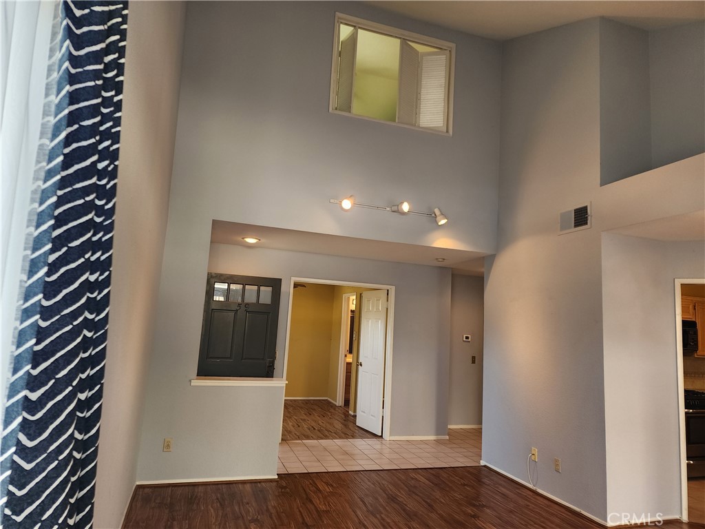 7350 Greenhaven Avenue, Unit 59 Rancho Cucamonga, CA 91730 - Photo 4 of 20 a view of entryway with wooden floor