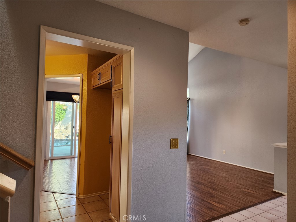 7350 Greenhaven Avenue, Unit 59 Rancho Cucamonga, CA 91730 - Photo 8 of 20 a view of a hallway with wooden floor