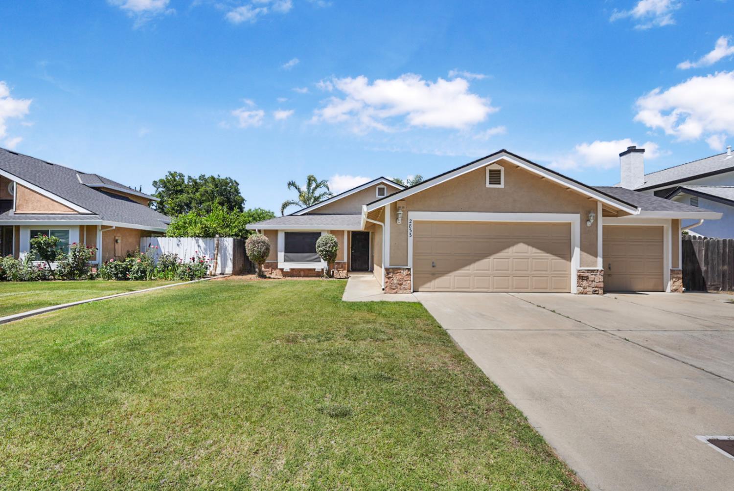 a front view of a house with a garden and porch